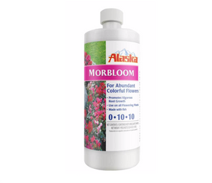 Alaska Morbloom Fertilizer (0-10-10) is a plant food made with natural-based fish. This product comes in a white cylindrical bottle with a white and floral label. On the left side of the label, there’s a photograph of various pink flowers. On the right, the label is white with text.