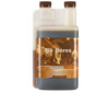 BioCanna Bio Flores (2-2-5) is a complete plant based nutrient for fast growing plants during the flowering stage. This product comes in a rectangular bottle with two brown lids. The label is sepia toned with an image of a farm, a woman holding to buckets, and a man near a cow. 