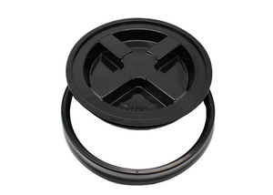 Gamma Seal Lid for 3.5 and 5 Gallon Plastic Pail turns pails into a resealable, airtight container. Made from a high density black polyethylene & FDA compliant. This product is shot slightly overhead. The lid has an “X” shape in the center, resting on another black ring. 