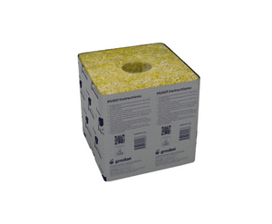 Grodan Hugo Block is the largest rockwool block; 6 x 6 x 6 inch Growing blocks with 1-1/2 inch hole for smaller cubes. These are used for growing real big plants. This product comes in a silver wrapper with purple text, the product is greenish in colour with a hole in the centre.